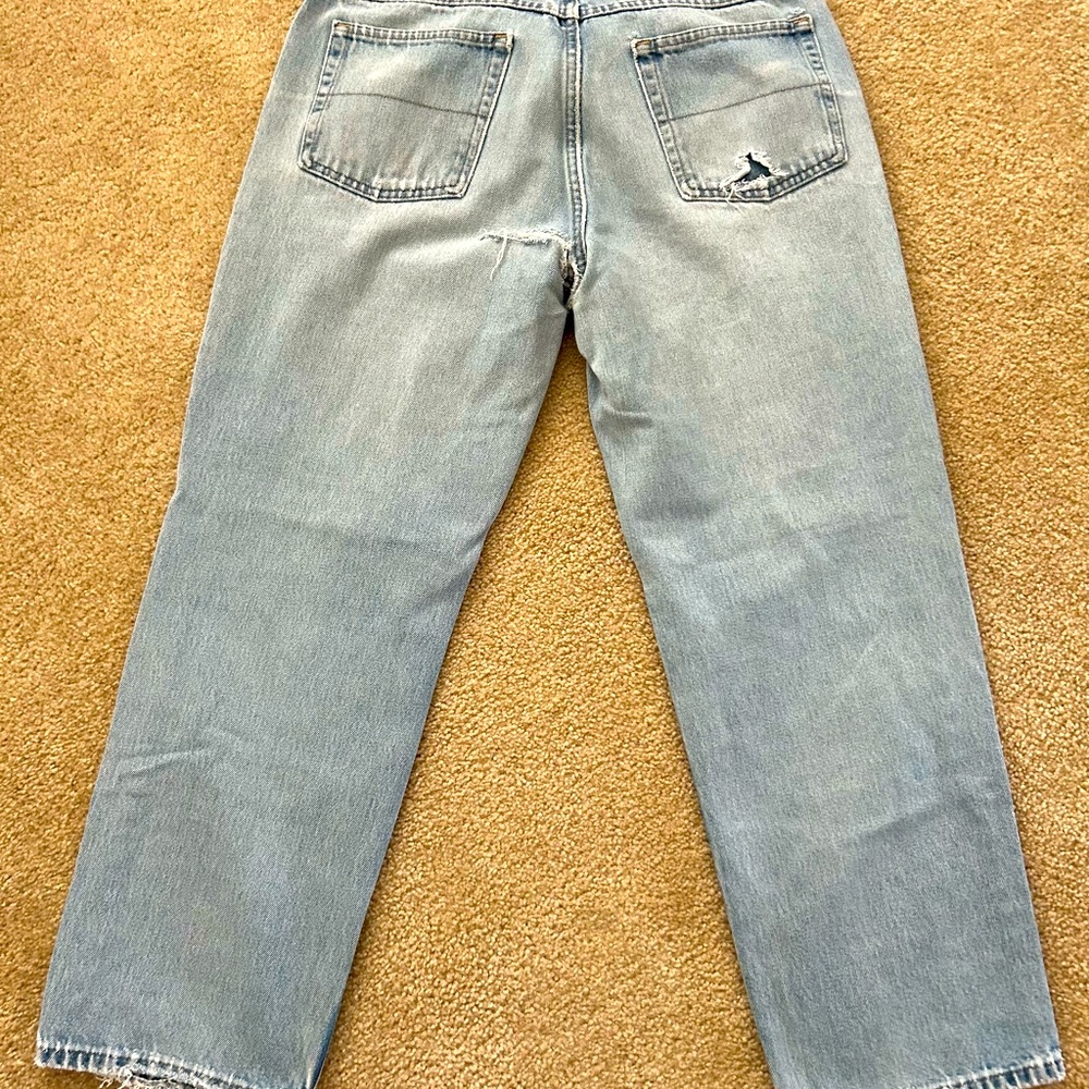 Distressed Canyon River Blues Men’s jeans size 36X29 light blue w/multiple rips.